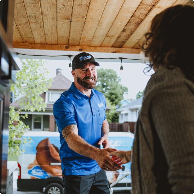 Bassett Services technician at a customer home