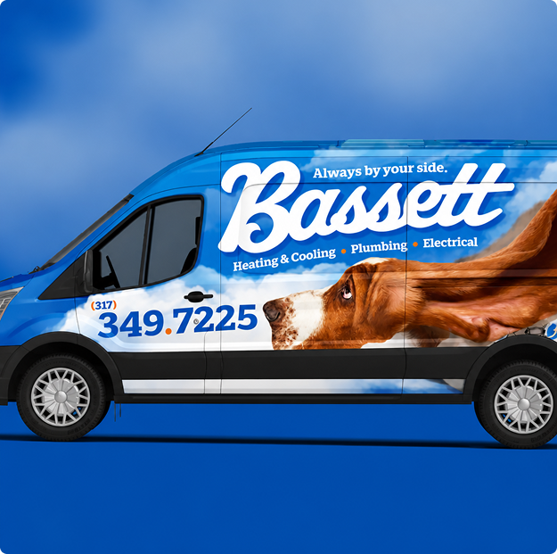 Blue Bassett Services heating, cooling, plumbing and electrical van wrapped with the hound mascot