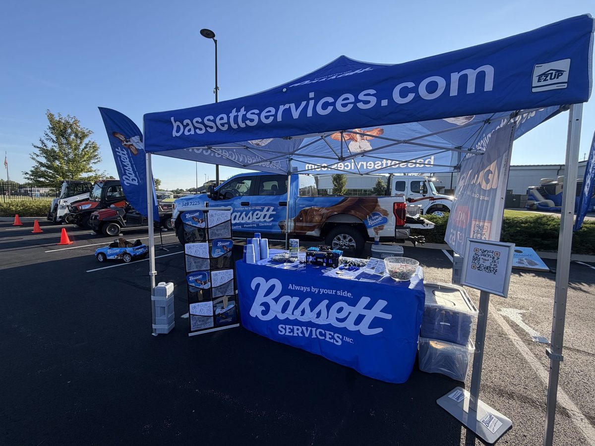 Bassett Services tent and service truck at a community Touch-A-Truck event